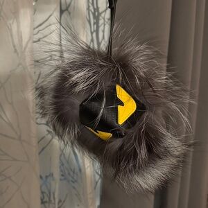 Gray Fur Pom Pom with Yellow Accents